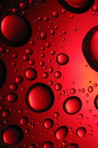 红色玻璃上的水滴高清手机桌面图片